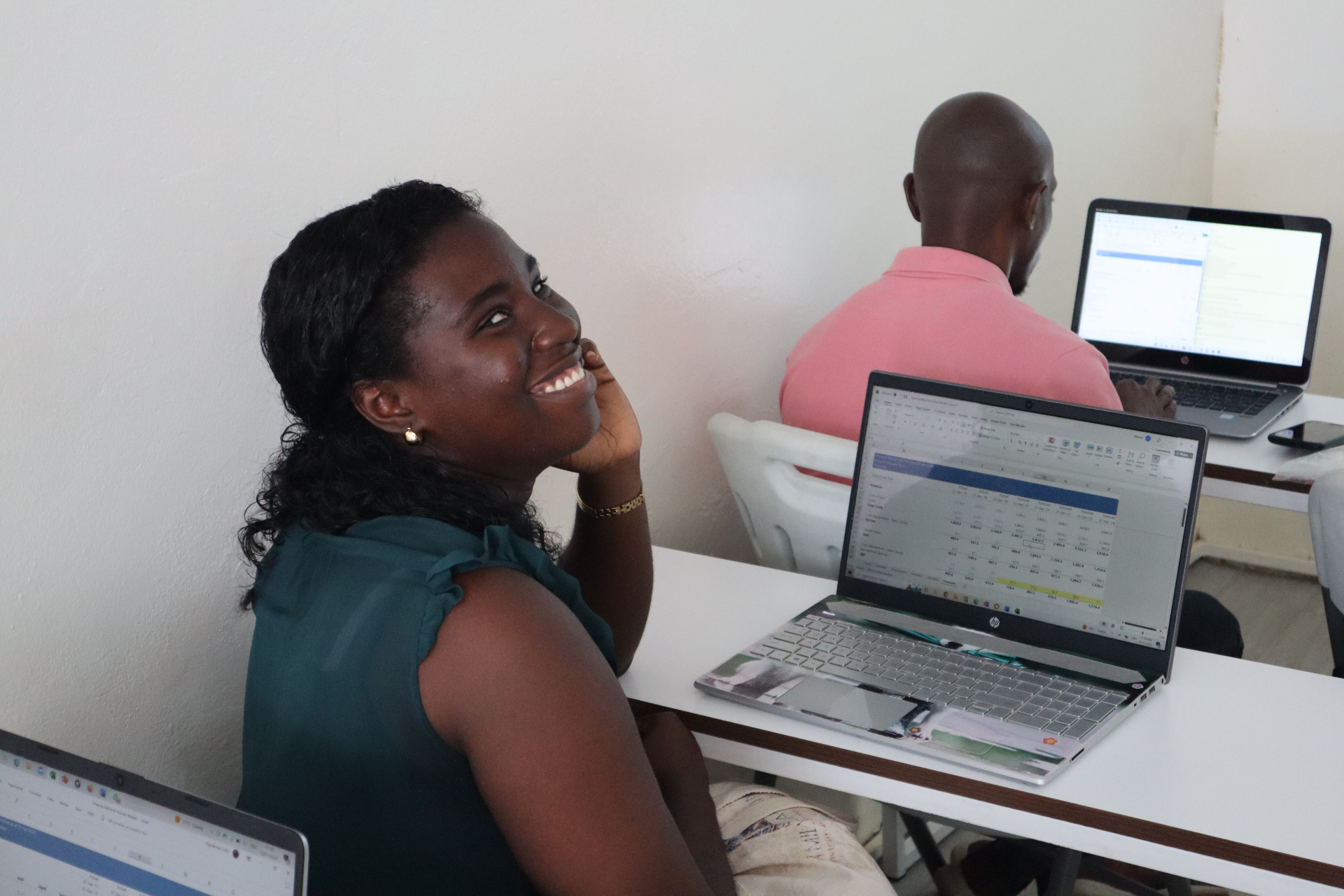 Young African professional learning on her laptop